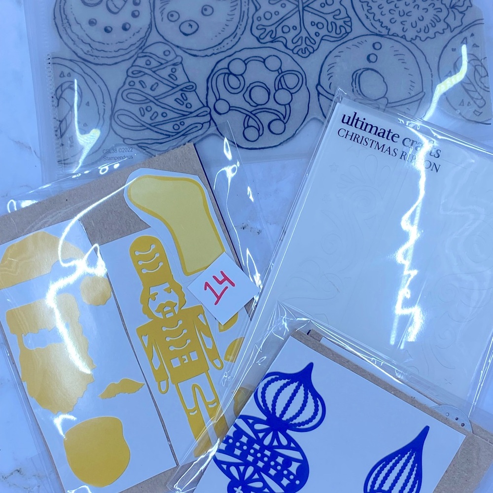 Four (4) Sets of Assorted Christmas Stamps, Dies, and embossing folder
(item 14)